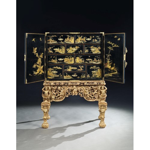 A Charles II black japanned cabinet on giltwood stand